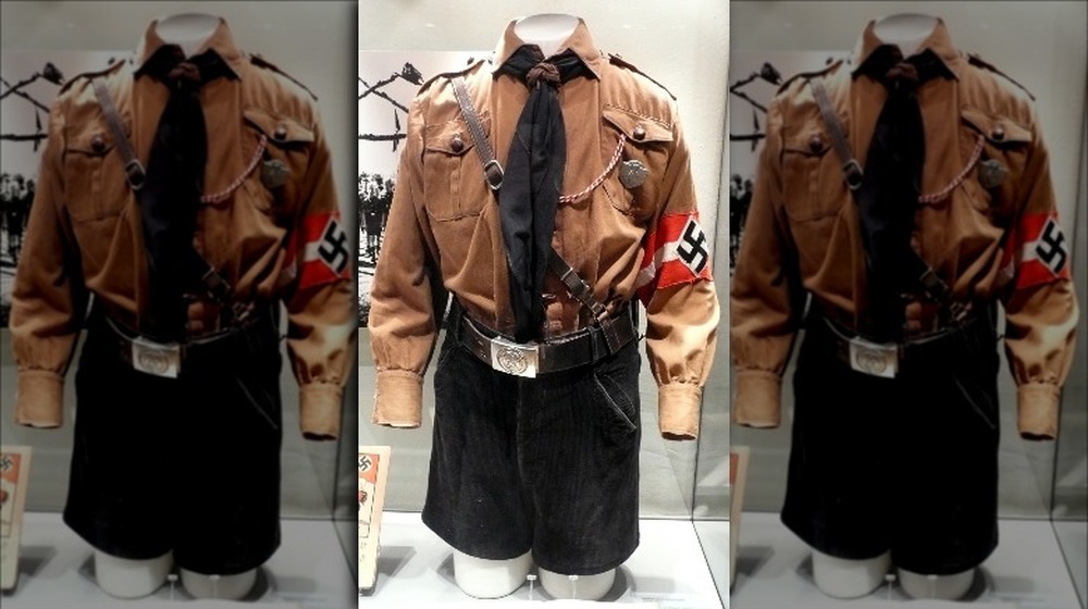 Hitler Youth uniform on display with black tie and swastika cuff