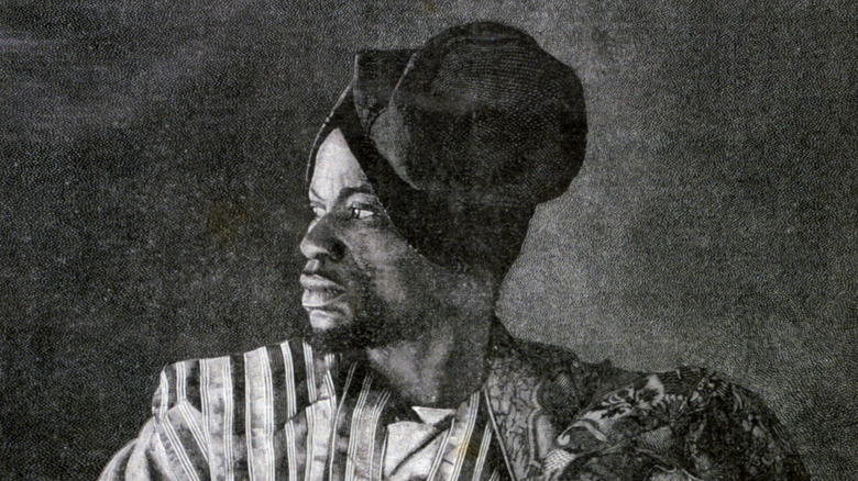 A Dahomean envoy turns his head for a portrait