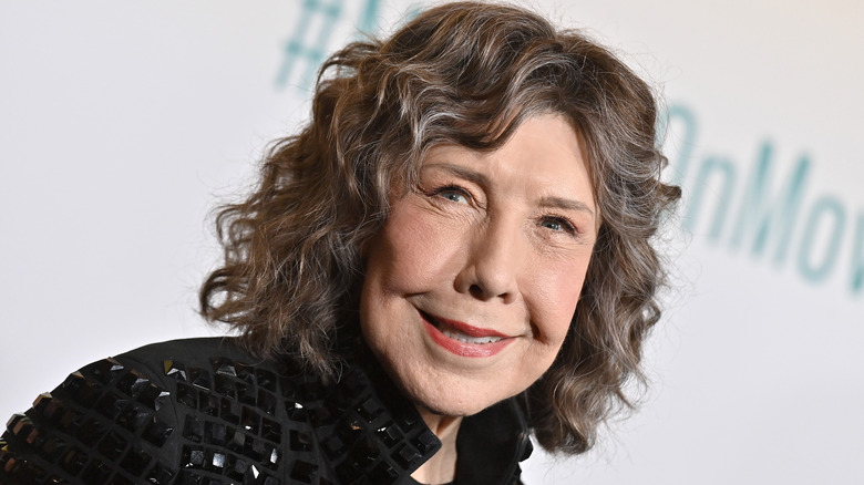 Lily Tomlin smiling at event