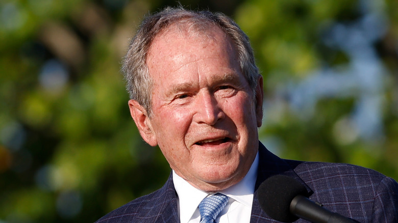 George W. Bush giving speech at a golf course