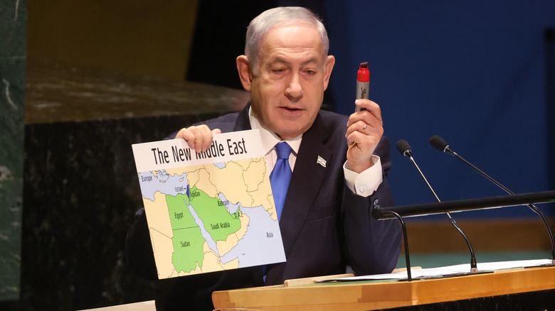 Benjamin Netanyahu holding a map