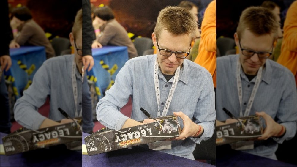 Matt Leacock autographing Pandemic game