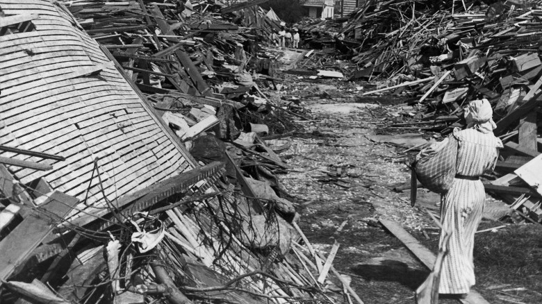 Woman with debris after a hurricane, black and white