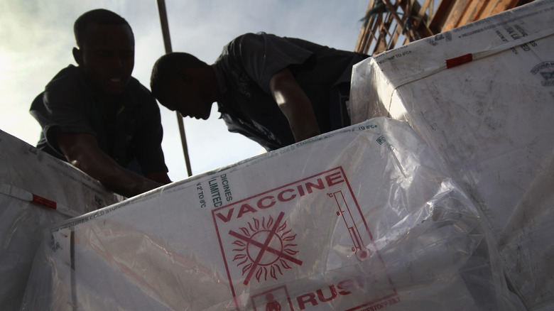 UNICEF workers unloading vaccines