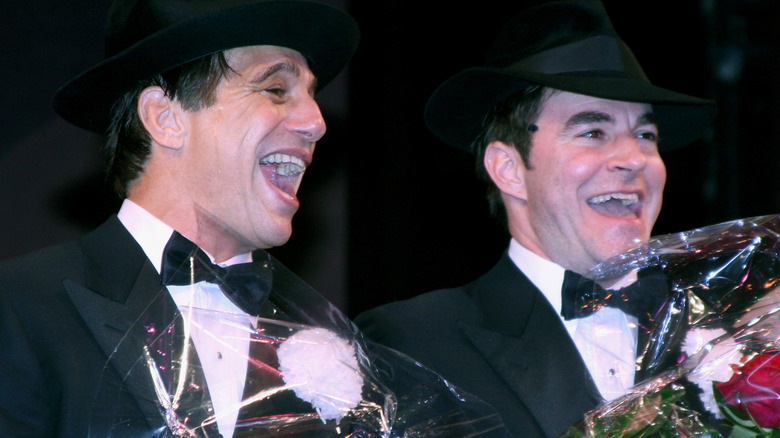 Tony Danza and Roger Bart smiling suit bowtie hat