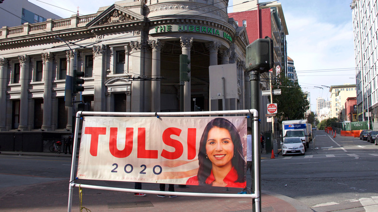 campaign sign in front of building
