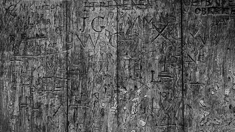 Graffiti carved into the back of the Coronation Chair