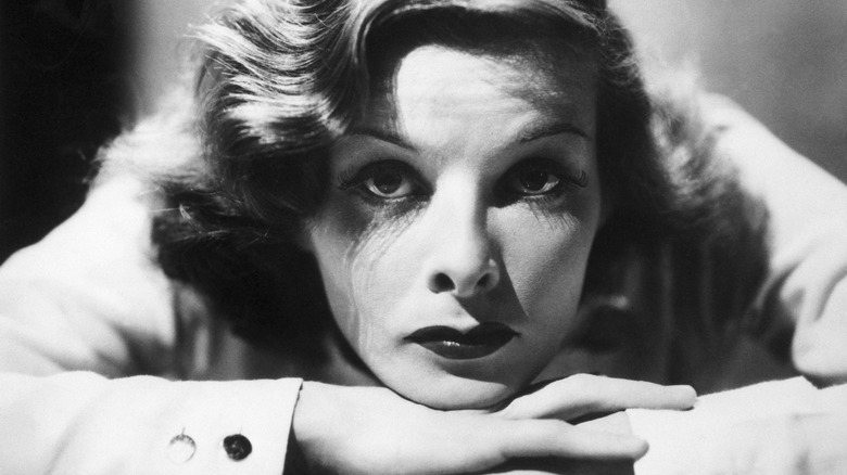 Katherine Hepburn resting her chin on arms