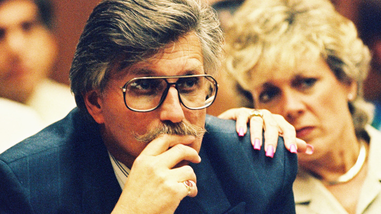Fred Goldman glasses suit moustache in court