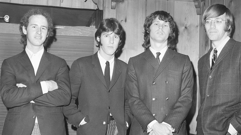 The Doors suits standing together smiling