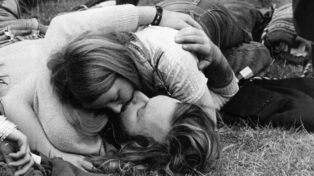 Hippies kissing outdoors