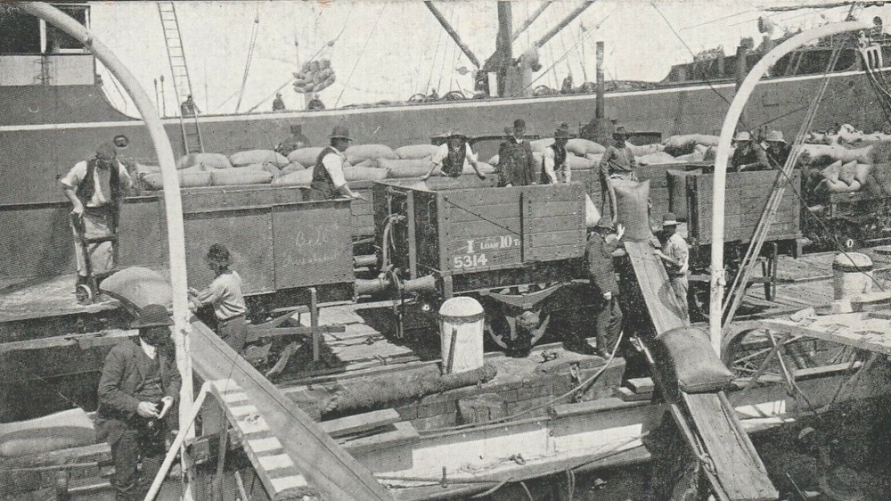 Crews work a freight vessel in 1911
