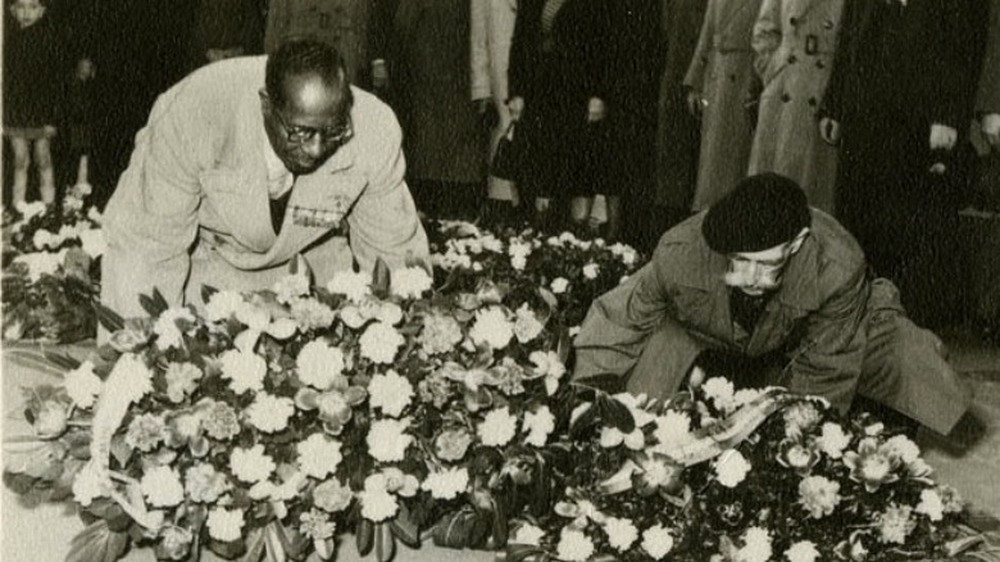 Eugene Bullard lays flowers at the Tomb of the Unknown Soldier in Paris in 1954