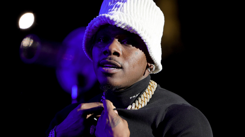dababy rapping onstage hat