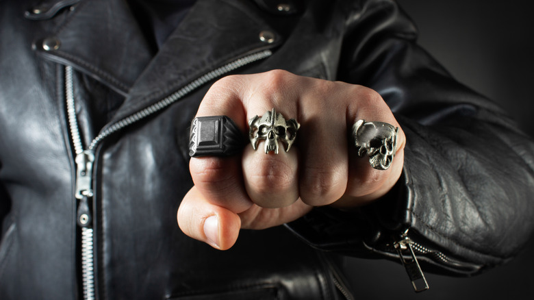 Clenched fist rings black leather jacket