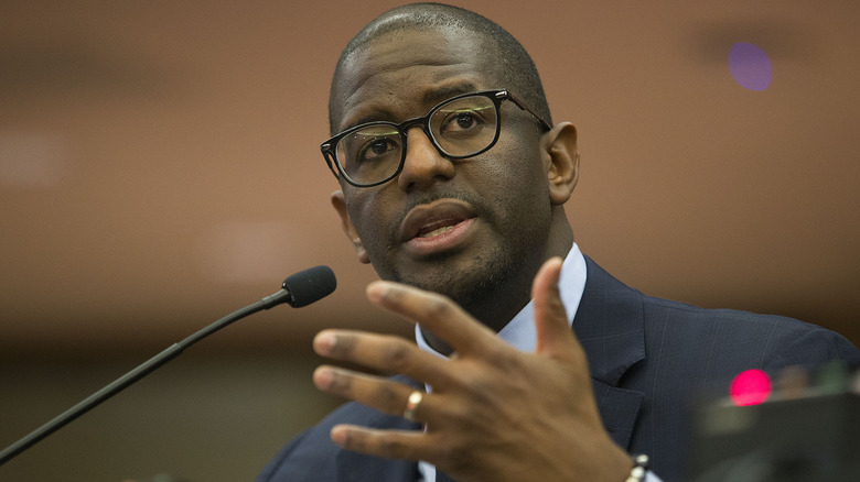 Andrew Gillum gesturing while speaking before a committee