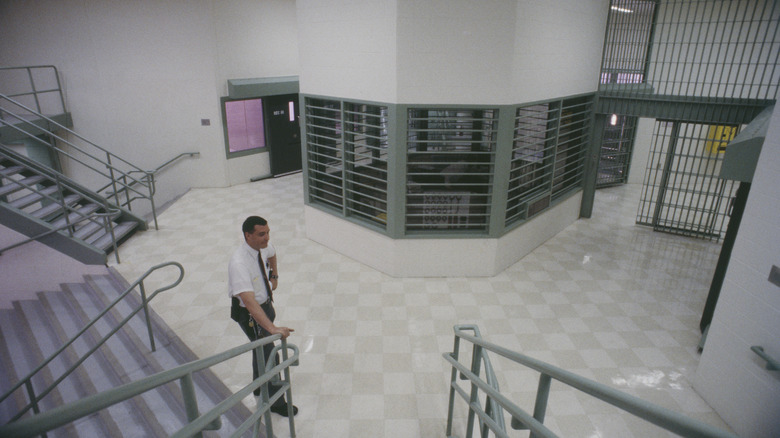 Interior of prison with guard