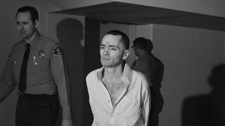 Charles Manson being escorted by police