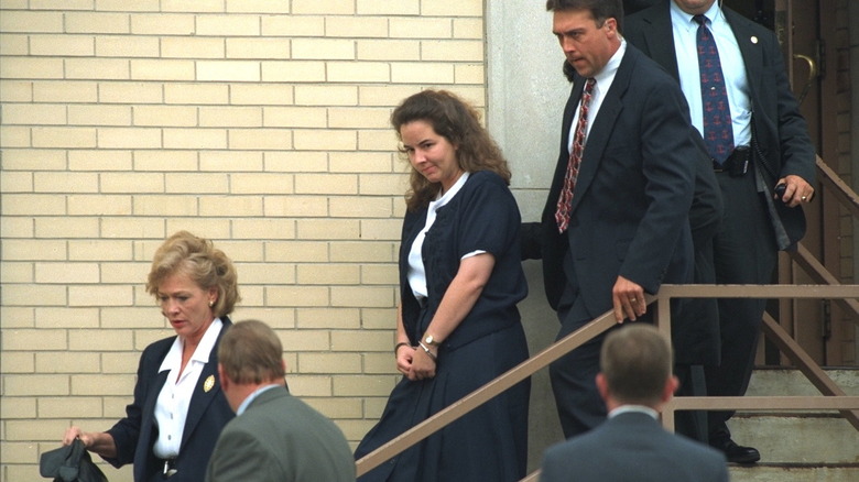 Susan Smith being escorted in handcuffs