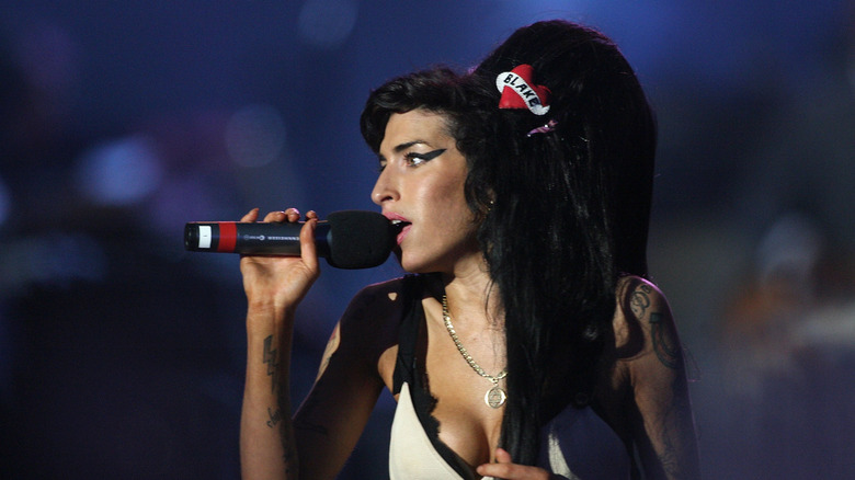 Amy Winehouse with beehive hair and microphone