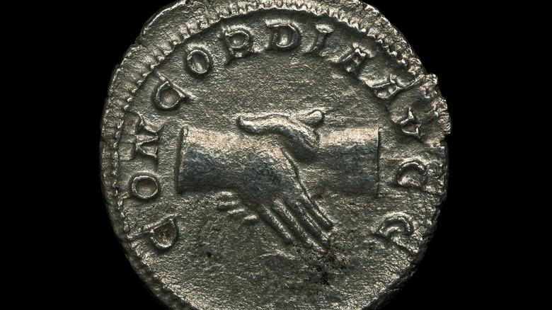 Roman coin with handshake 