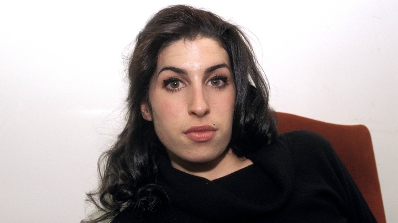 Young Amy Winehouse in black shirt