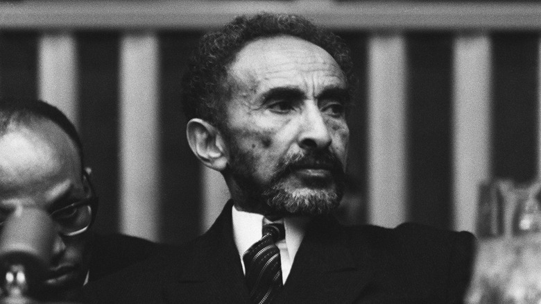 Haile Selassie I suit at political gathering