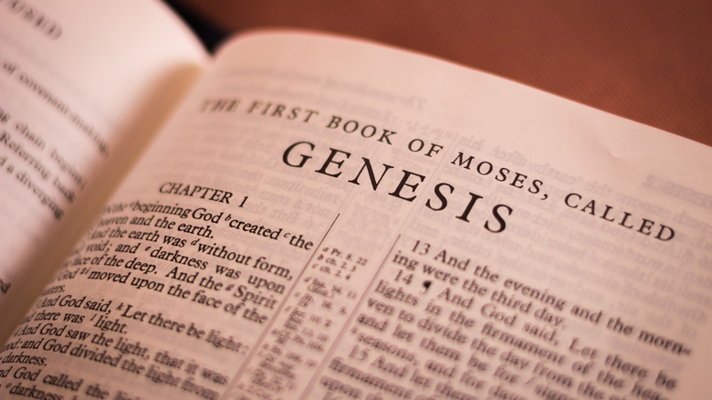A Bible turned to the start of the Book of Genesis.