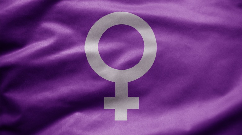 The Venus symbol printed on a purple backbround.