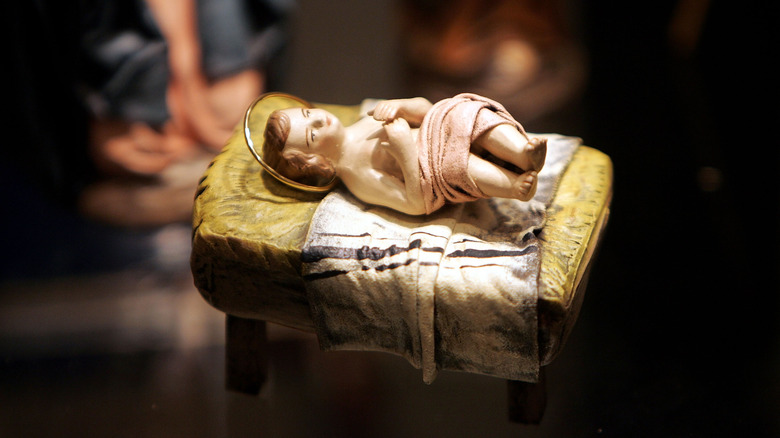 baby jesus figurine in manger