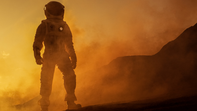 astronaut walking on martian soil
