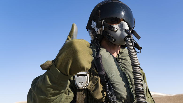 military pilot giving thumbs up