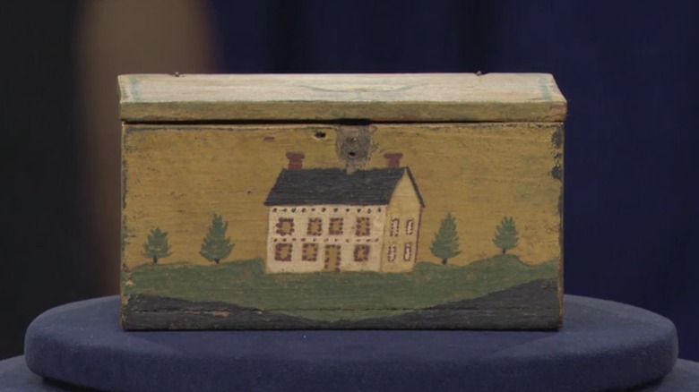 wooden box with painted house