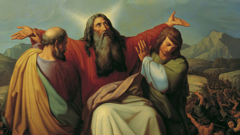 painting of Moses being carried praying