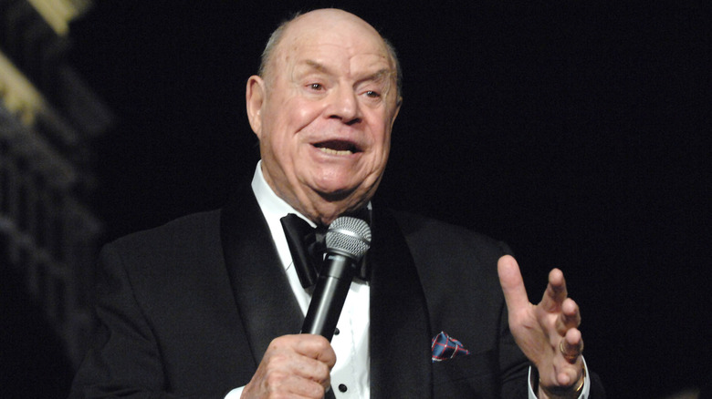 Don Rickles on stage with microphone