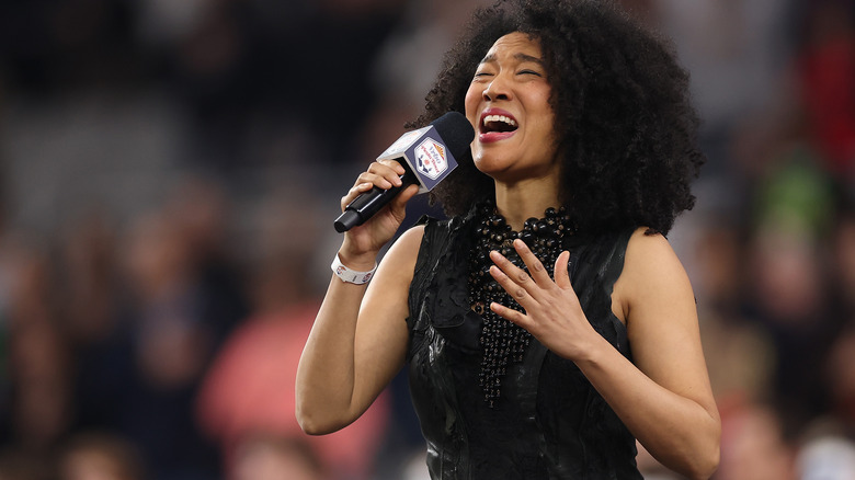 Judith Hill singing in front of a crowd