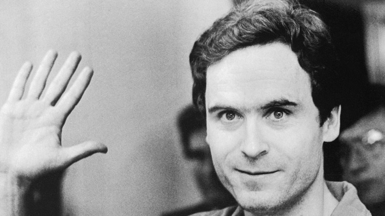 ted bundy holding up hand