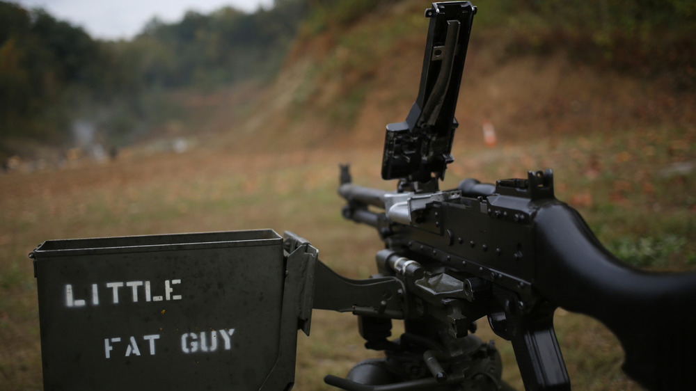 Belt-fed machine gun pointed down range
