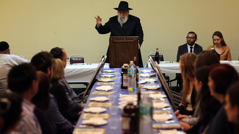 A rabbi leads a seder meal