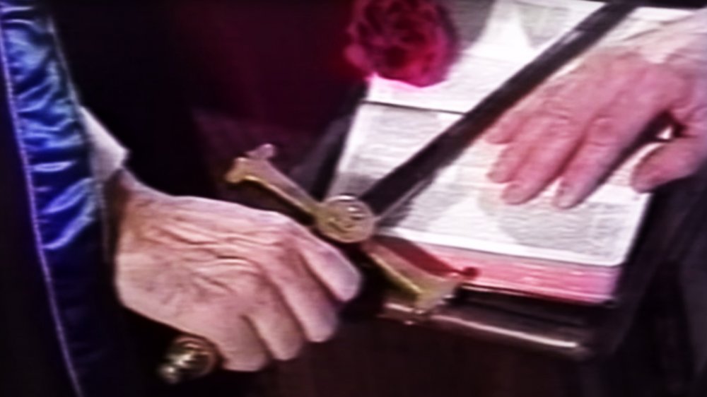 Closeup of sword and bible used by Order of the Solar Temple