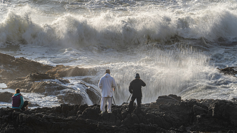Visitors standing on the rim of Thor's Well