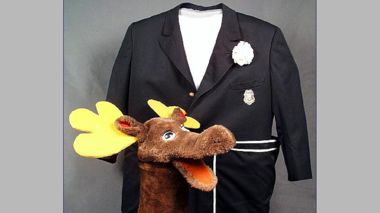 Photo of Captain Kangaroo's original blue jacket and Mister Moose puppet