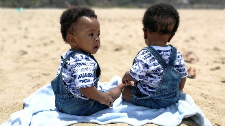 Two babies on the beach