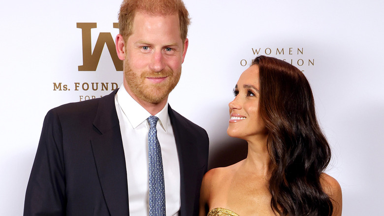 Prince Harry and Meghan Markle on a red carpet
