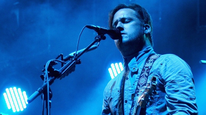 Isaac Brock singing and playing guitar in 2015