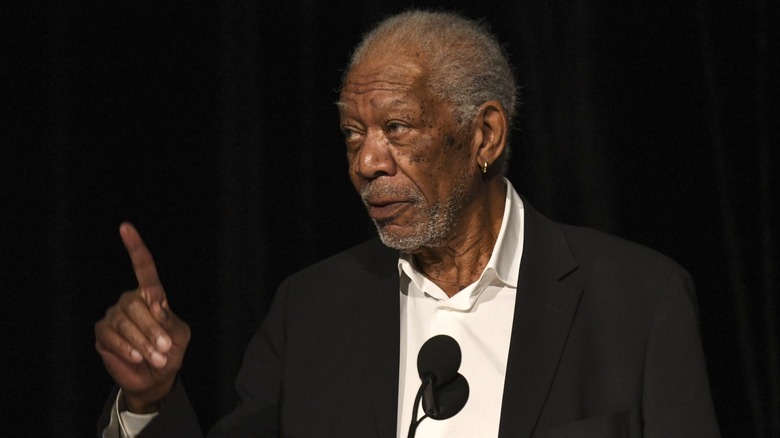 Morgan Freeman at podium pointing finger up