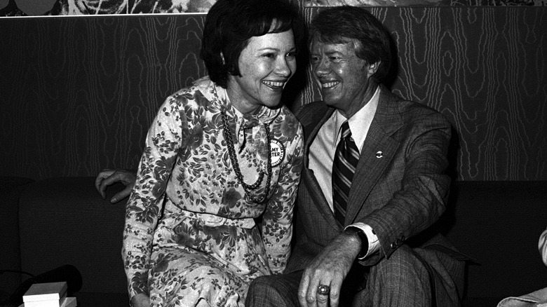 Rosalynn and Jimmy Carter sitting and laughing