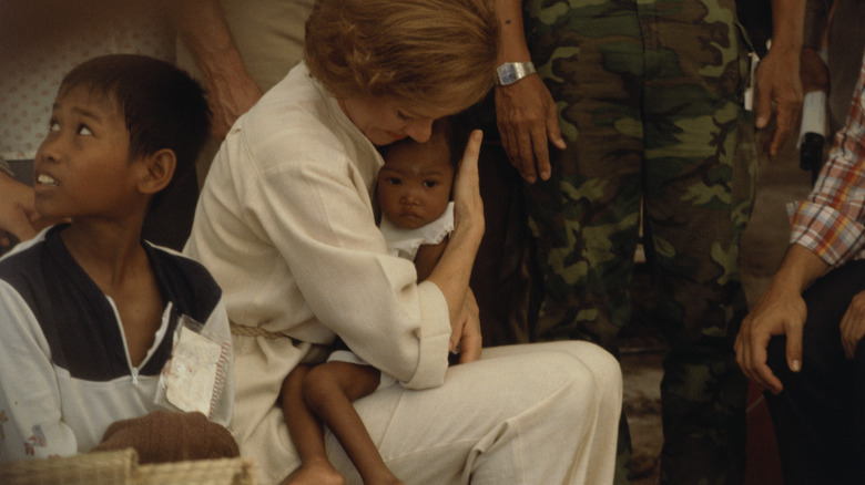 Rosalynn Carter holding a Cmabodian refugee