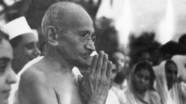 Ghandi prays amid crowd