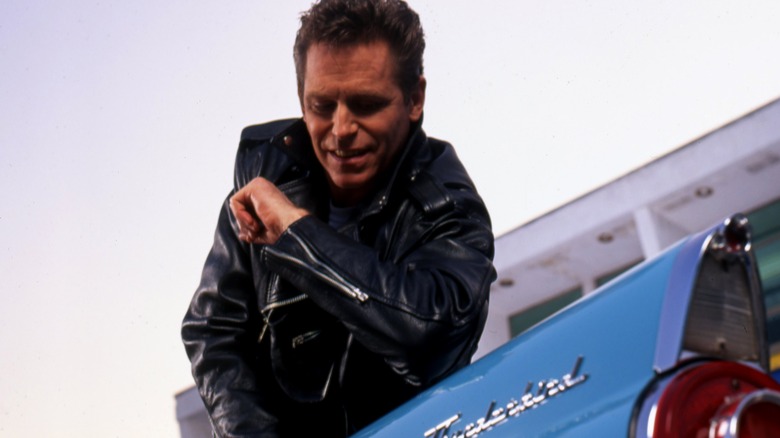 Jeff Conaway rests on a Thunderbird